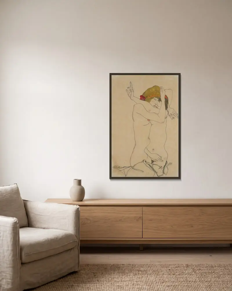 Zwei sich umarmende Frauen von Egon Schiele gerahmt an einer Wand