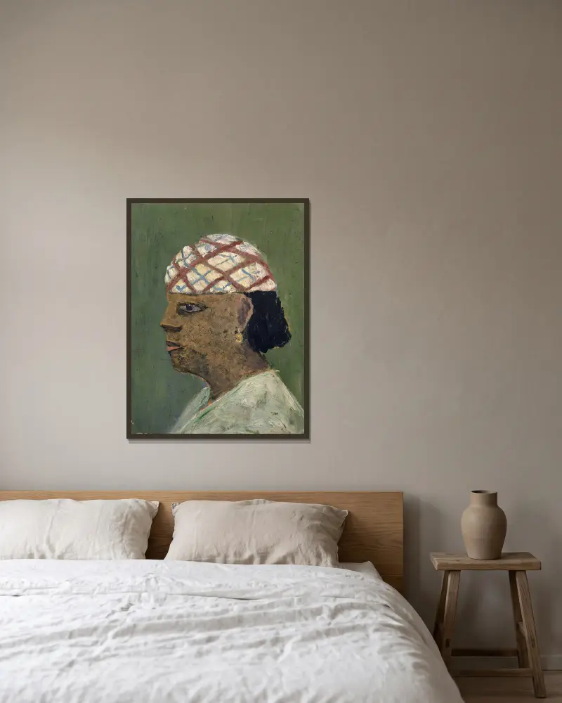 Huvud av en kvinna från Sudan av Ernst Schiess inramad på en vägg