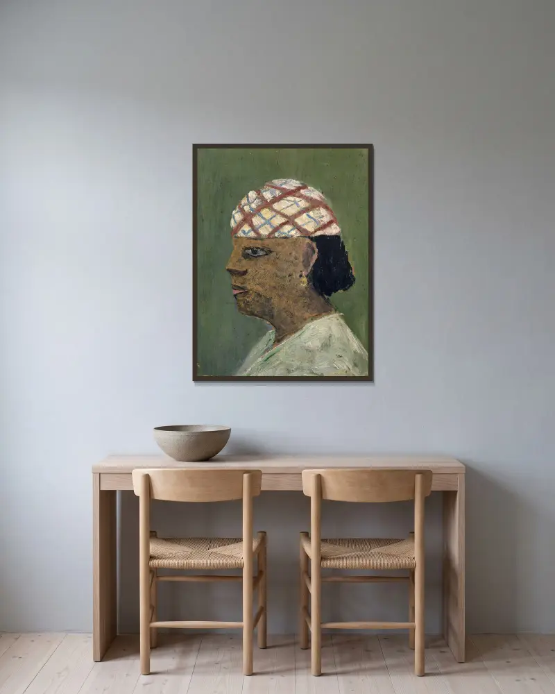 Huvud av en kvinna från Sudan av Ernst Schiess inramad på en vägg