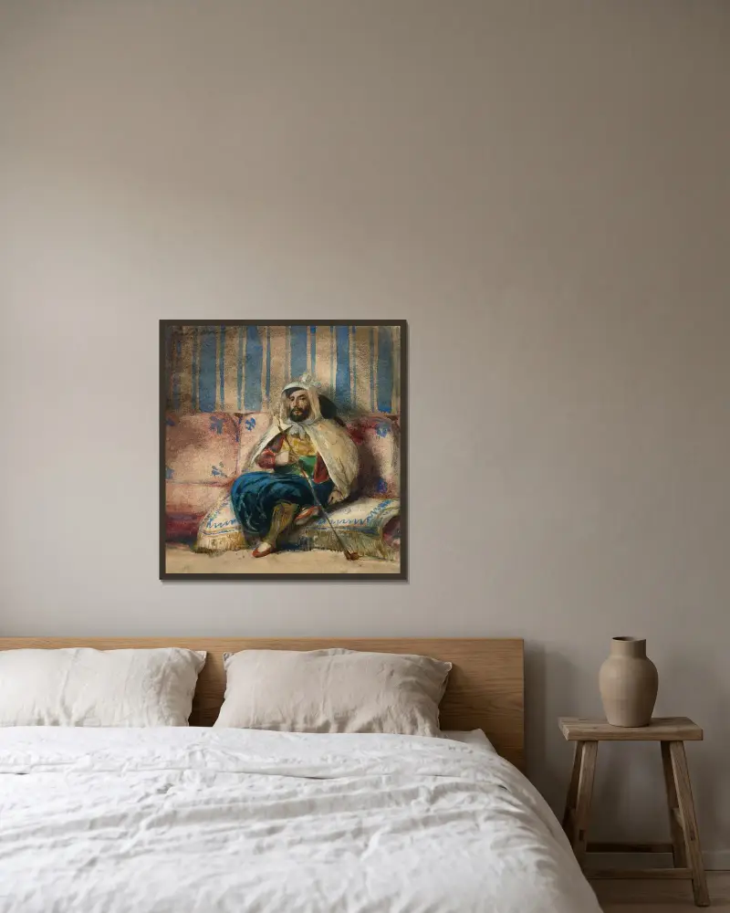 Man i orientalisk dräkt som röker på en soffa av Eugène Delacroix inramad på en vägg