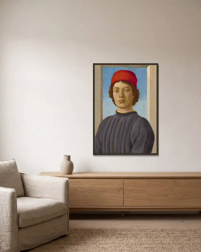 Porträtt av en ung man av Filippino Lippi inramad på en vägg