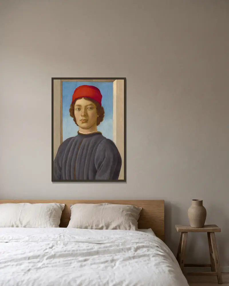 Porträtt av en ung man av Filippino Lippi inramad på en vägg