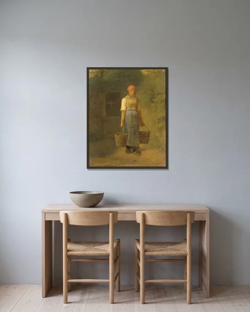 Flicka bärande vatten av Jean-François Millet inramad på en vägg