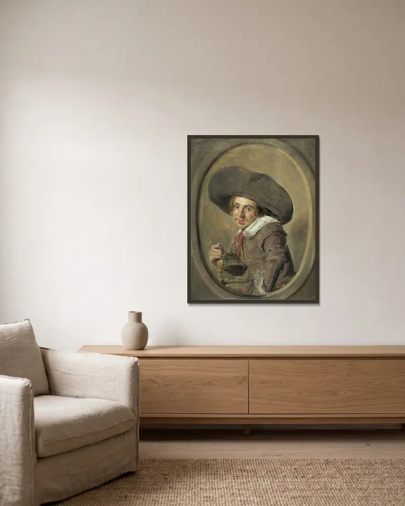 A Young Man in a Large Hat av Frans Hals inramad på en vägg