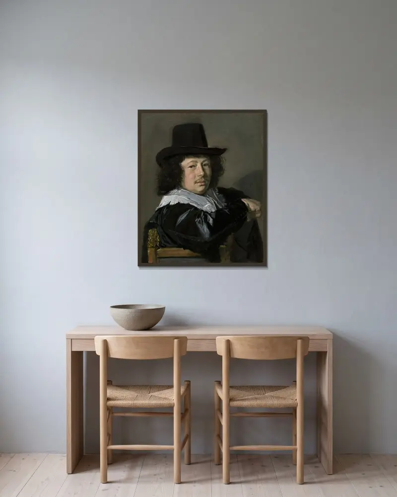 Bildnis eines jungen Mannes von Frans Hals gerahmt an einer Wand