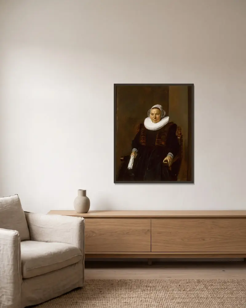 Porträtt av en äldre kvinna, traditionellt kallad Mevrouw Bodolphe av Frans Hals inramad på en vägg