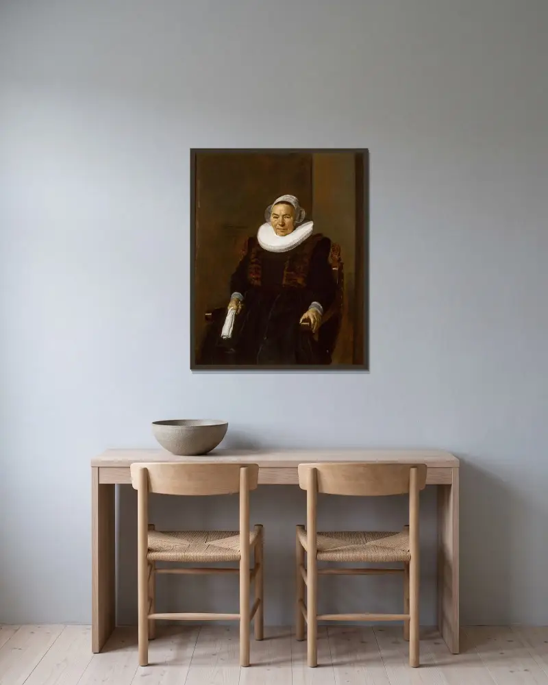 Porträtt av en äldre kvinna, traditionellt kallad Mevrouw Bodolphe av Frans Hals inramad på en vägg