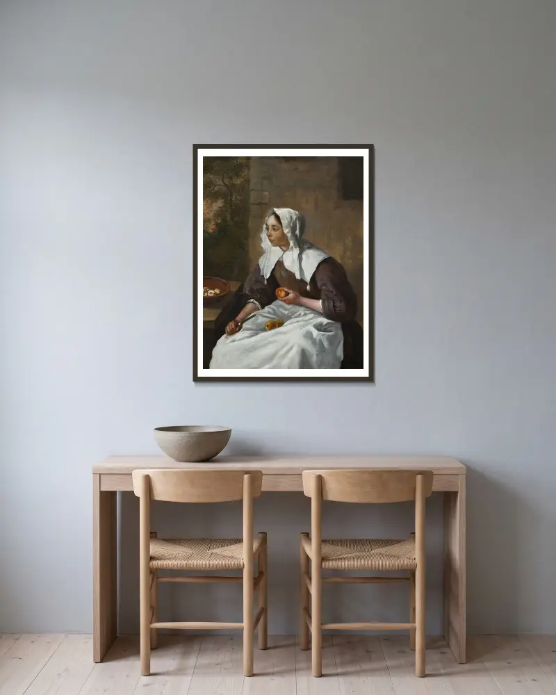 Dívka loupající jablka, Gabriel Metsu v rámu na stěně
