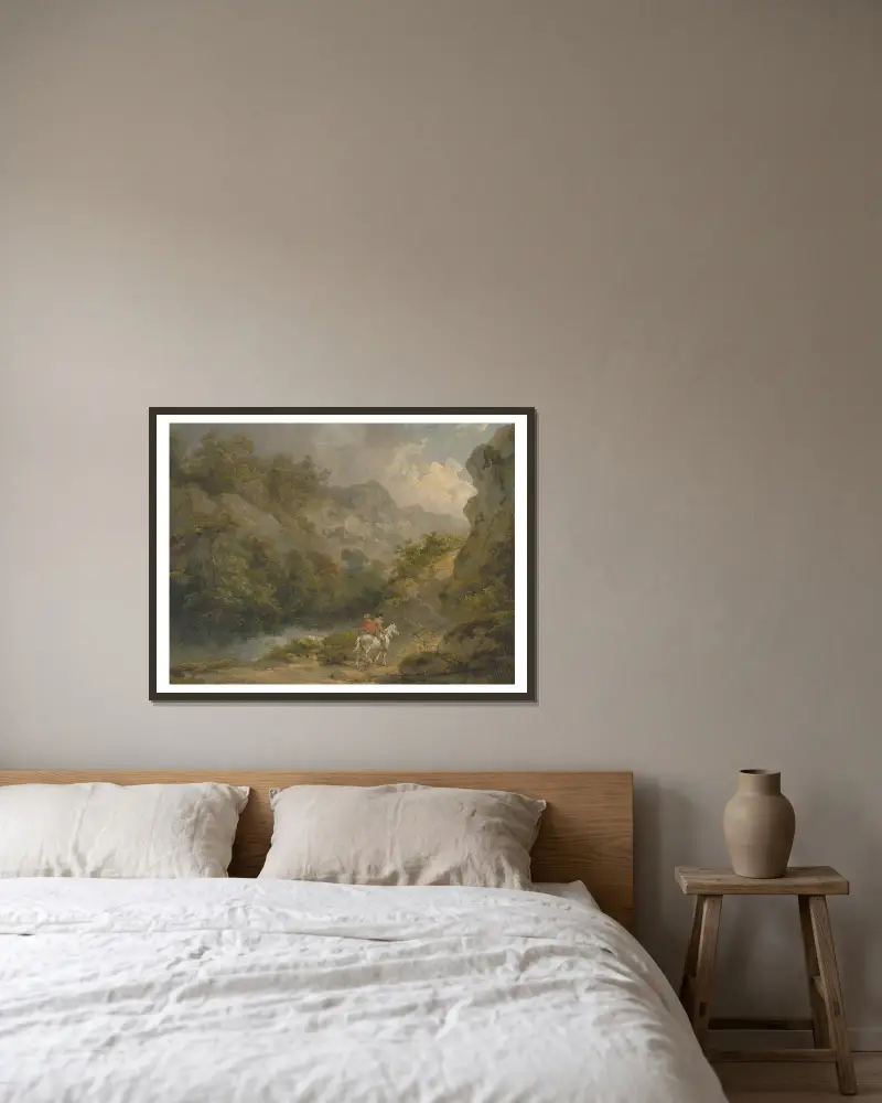 Kuperat landskap med två män på en häst av George Morland inramad på en vägg