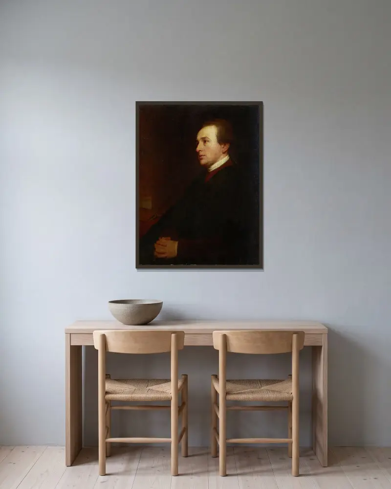 Porträtt av en ung man vid sitt skrivbord av George Romney inramad på en vägg