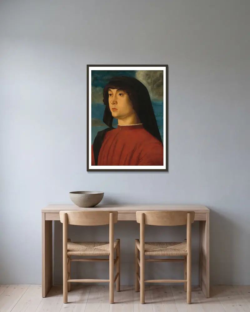 Portrait of a Young Man in Red av Giovanni Bellini inramad på en vägg