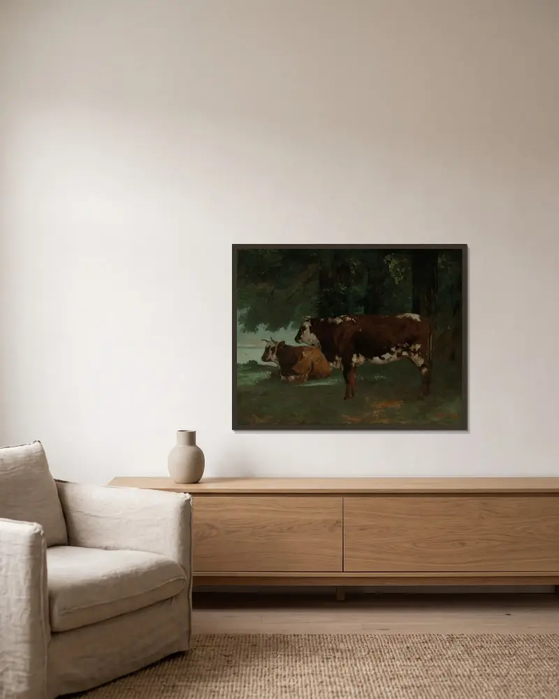 Två kor med brun päls av Gustave Courbet inramad på en vägg