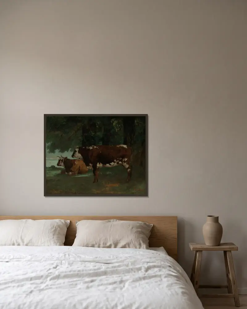 Två kor med brun päls av Gustave Courbet inramad på en vägg
