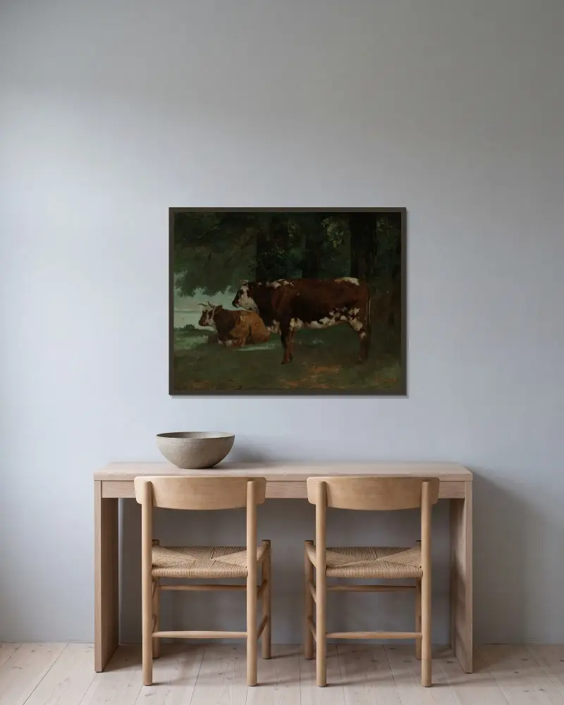 Två kor med brun päls av Gustave Courbet inramad på en vägg