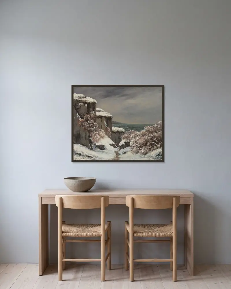Klippor vid havet i snö av Gustave Courbet inramad på en vägg