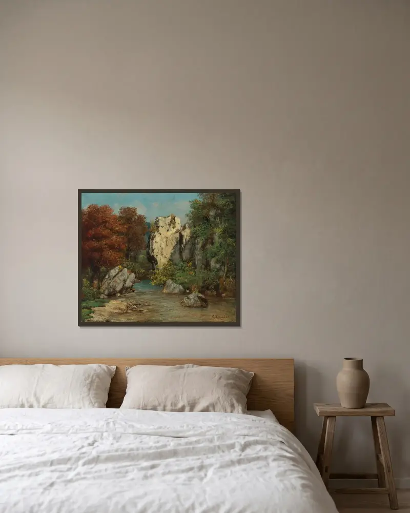 Landskap med bäck och klippa av Gustave Courbet inramad på en vägg