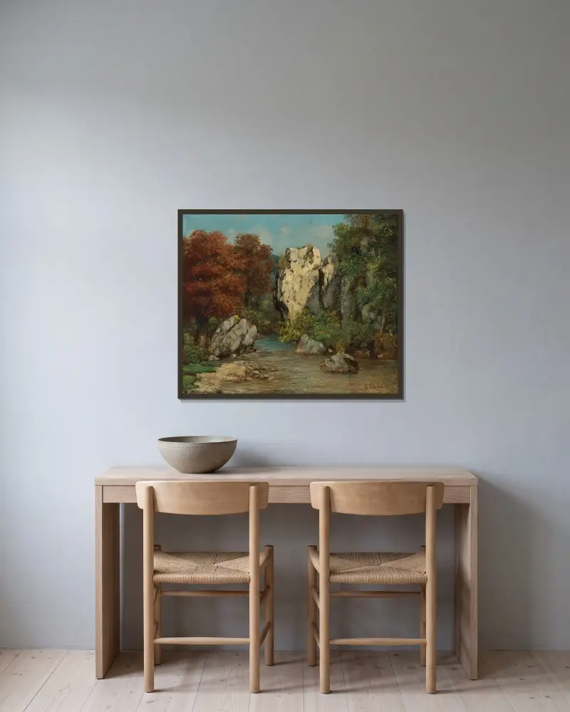 Landskap med bäck och klippa av Gustave Courbet inramad på en vägg