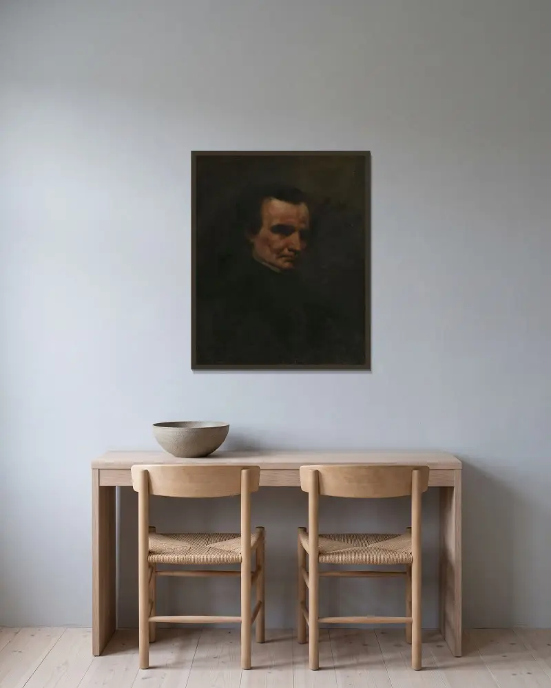 Porträtt av kompositören Hector Berlioz av Gustave Courbet inramad på en vägg