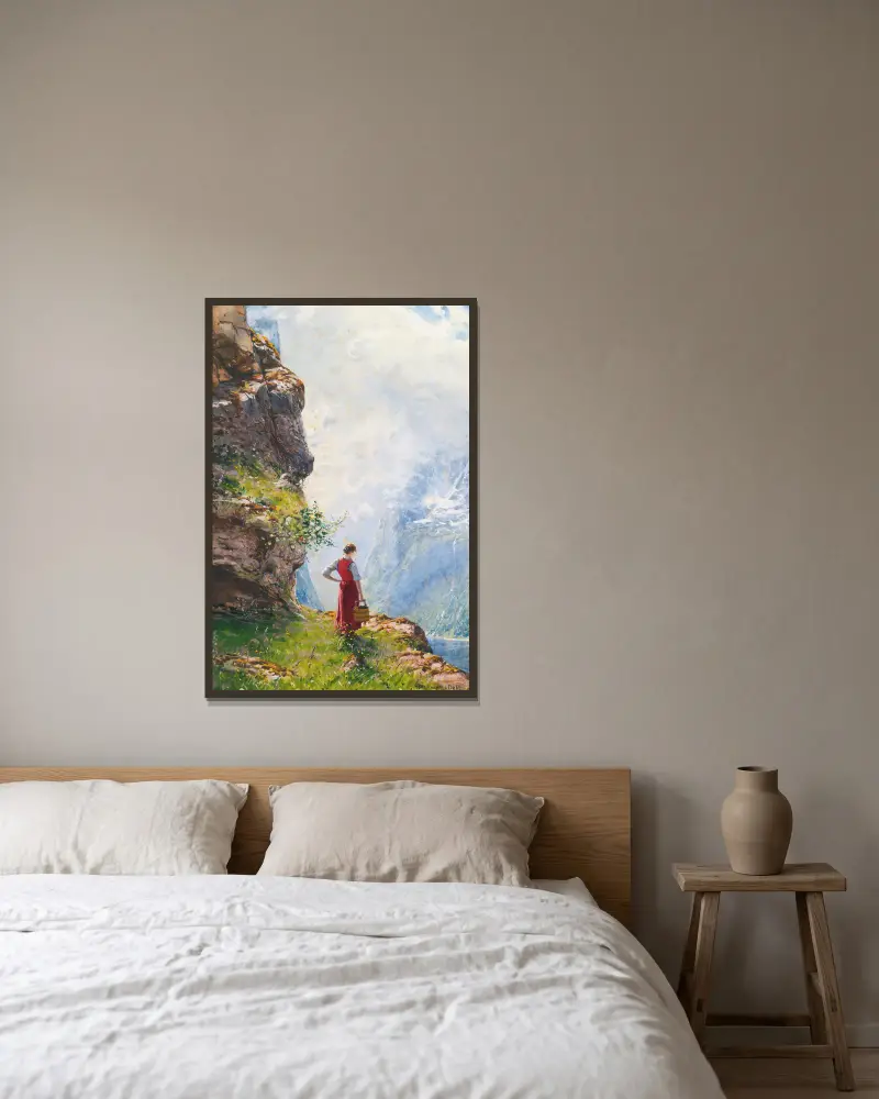 En ung flicka vid en fjord av Hans Dahl inramad på en vägg