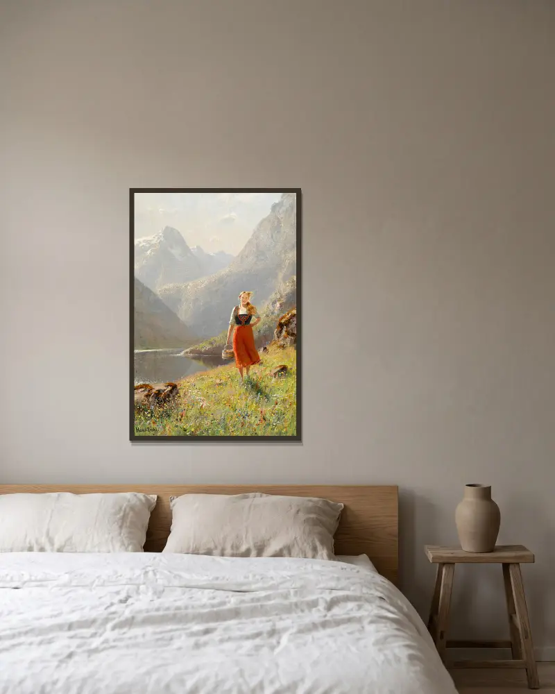 Ung flicka med korg i bergen av Hans Dahl inramad på en vägg
