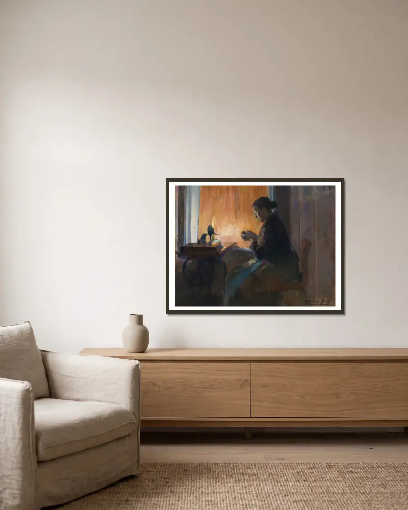 By Lamp Light av Harriet Backer inramad på en vägg
