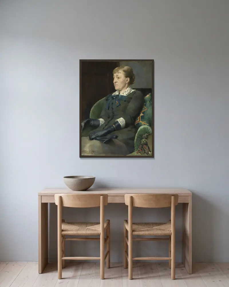 Porträtt av målaren Kitty Kielland av Harriet Backer inramad på en vägg