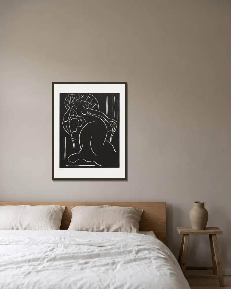Femme au fauteuil av Henri Matisse inramad på en vägg