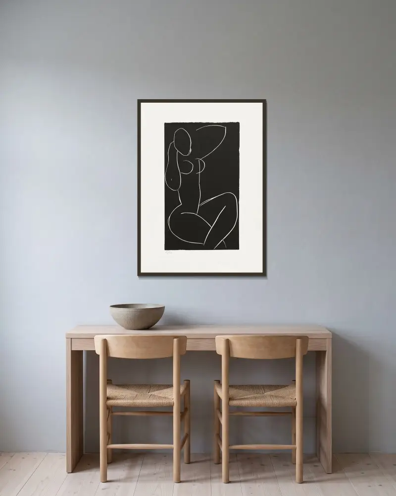 Sittande naken med benen i kors I av Henri Matisse inramad på en vägg