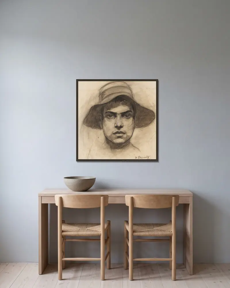 Männerkopf mit Hut von Hermann Stenner gerahmt an einer Wand