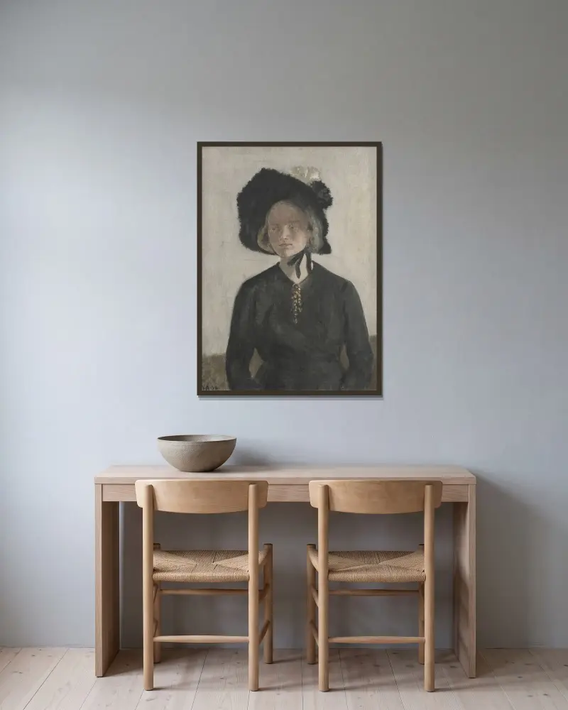 Konstnärens hustru Eva av Ivar Arosenius inramad på en vägg