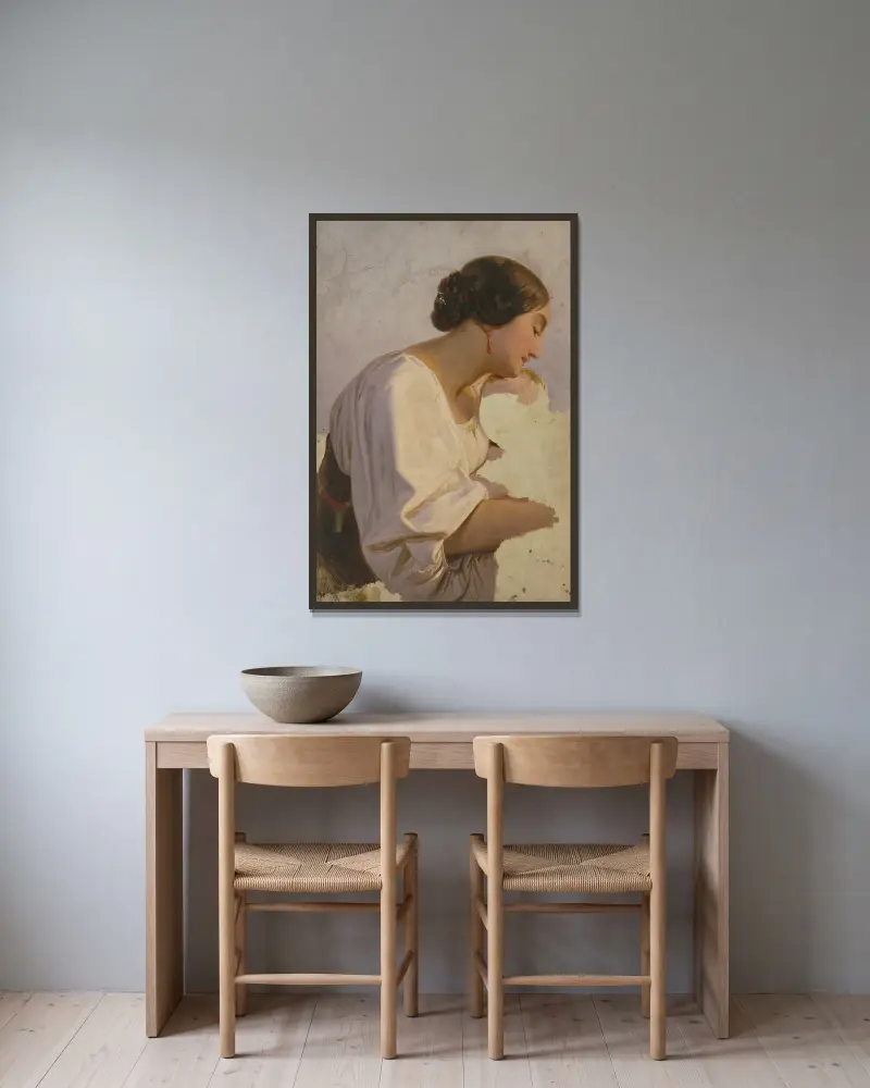 Mädchen mit Ohrringen von Jakob Becker gerahmt an einer Wand