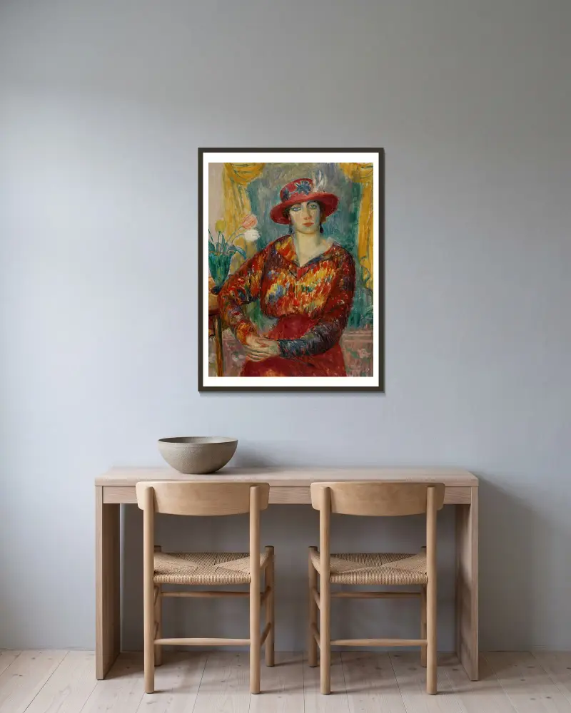 Frau in roter Bluse mit Tulpen von William James Glackens gerahmt an einer Wand