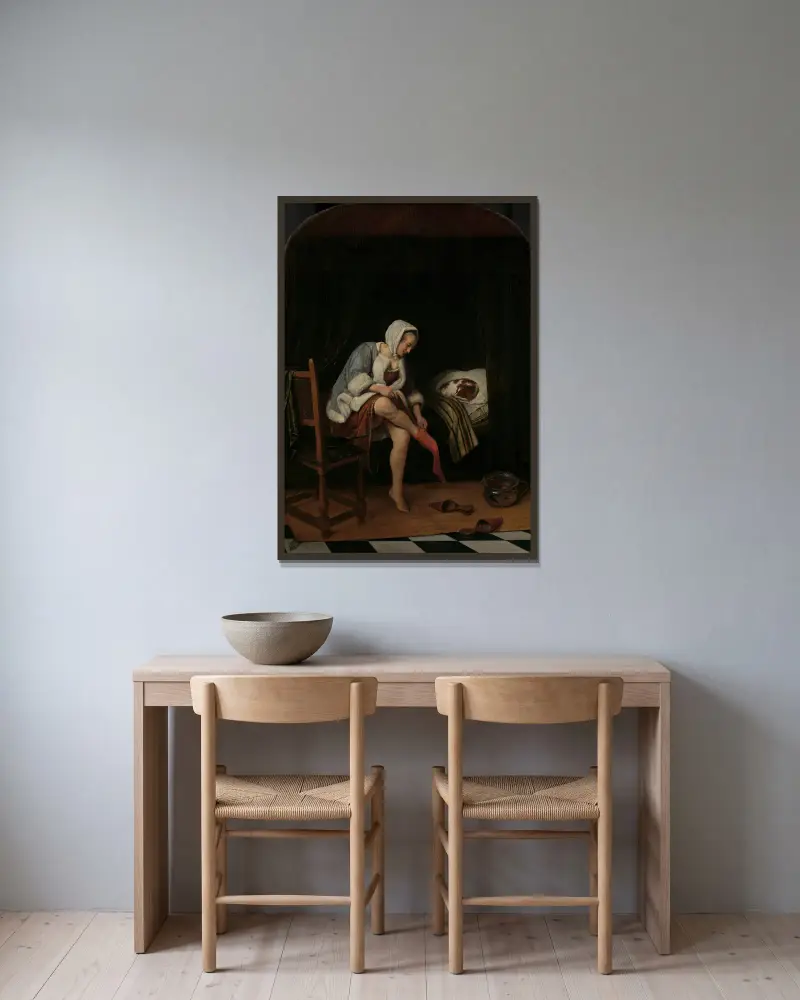Kvinna vid sin toalett av Jan Steen inramad på en vägg