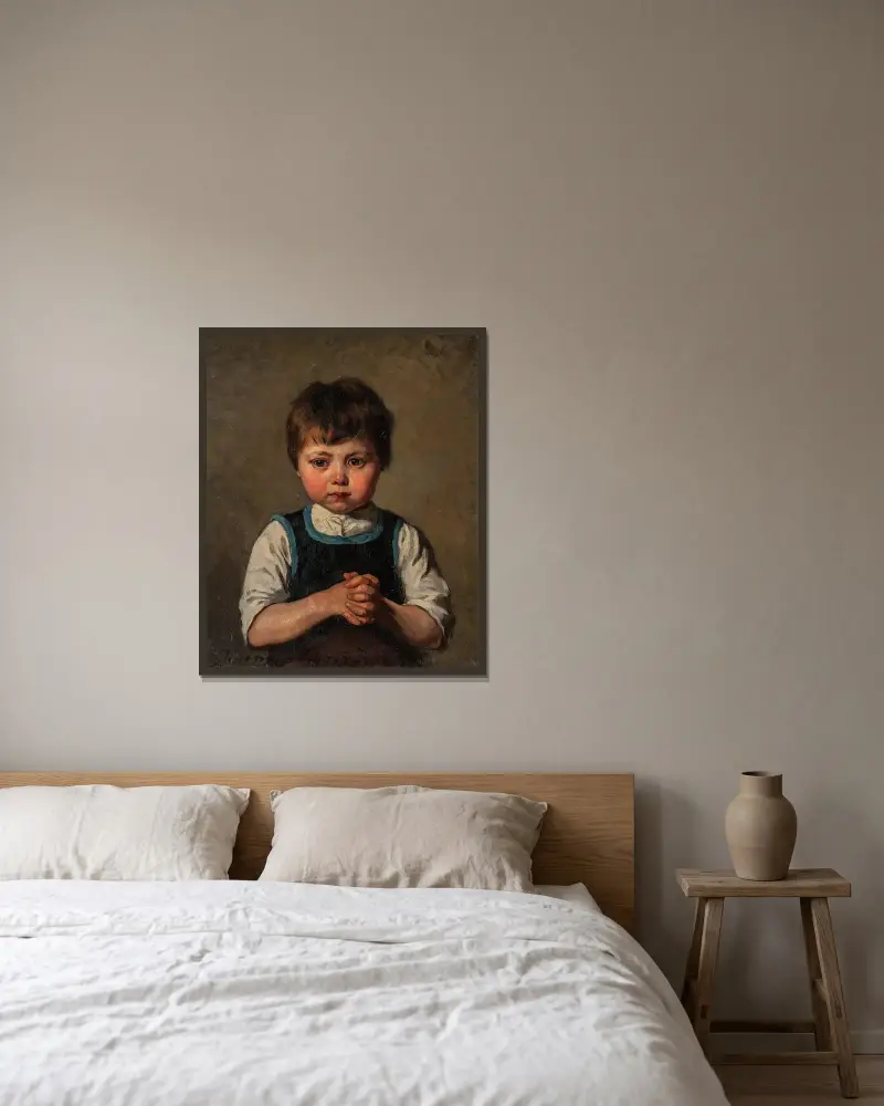 Bildnis eines Jungen von Jenny Nyström gerahmt an einer Wand