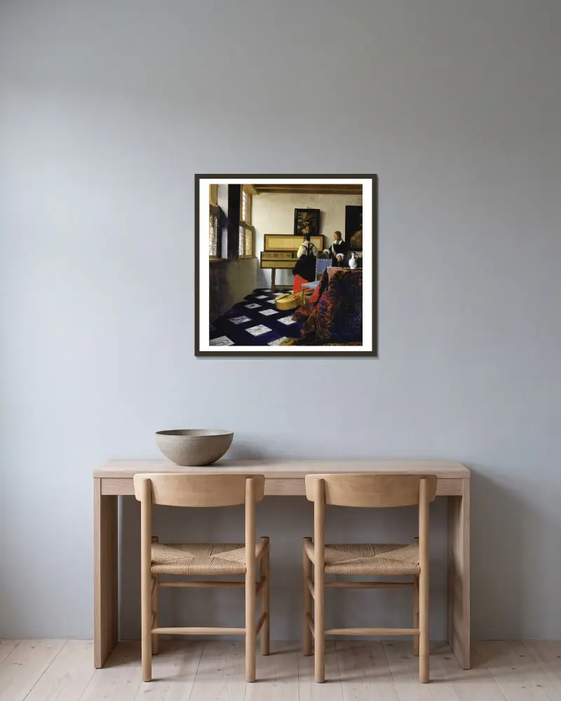 Musiklektionen av Johannes Vermeer inramad på en vägg