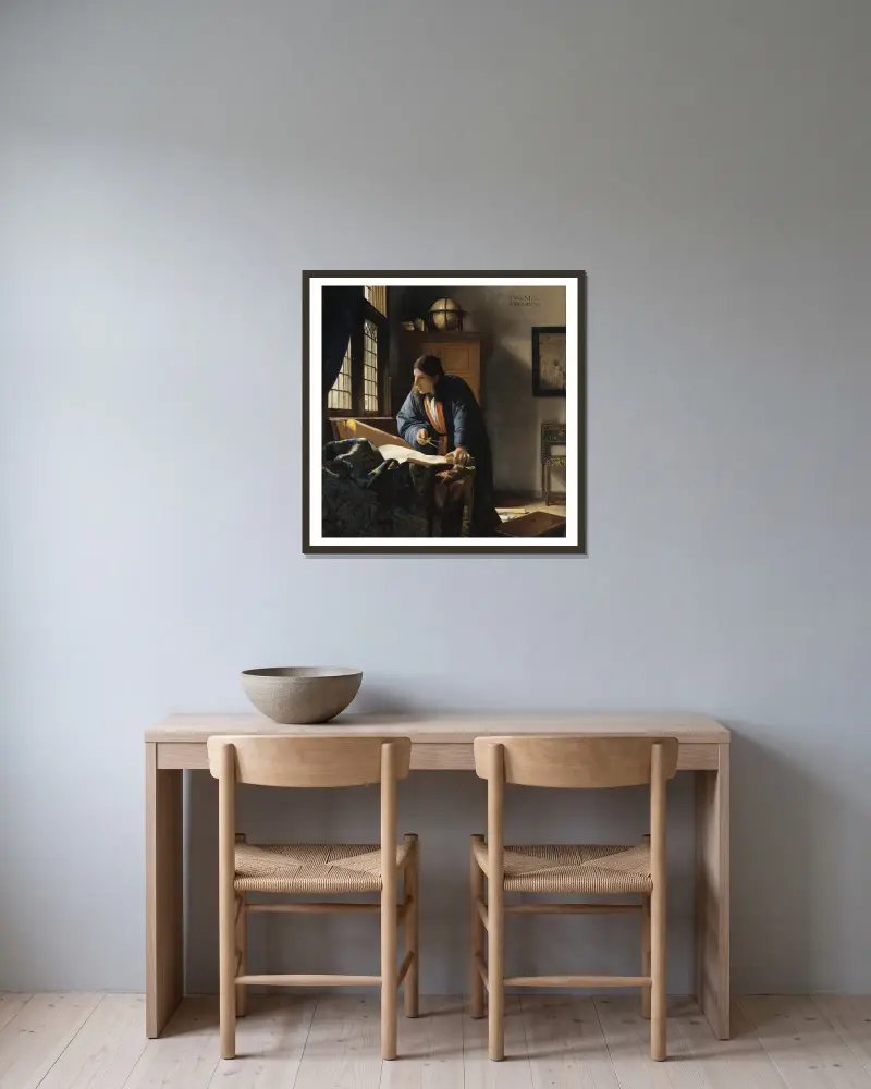 Der Geograph von Johannes Vermeer gerahmt an einer Wand