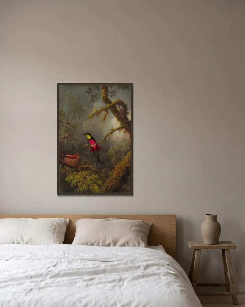 Ett par häckande röda topaskolibrier av Martin Johnson Heade inramad på en vägg