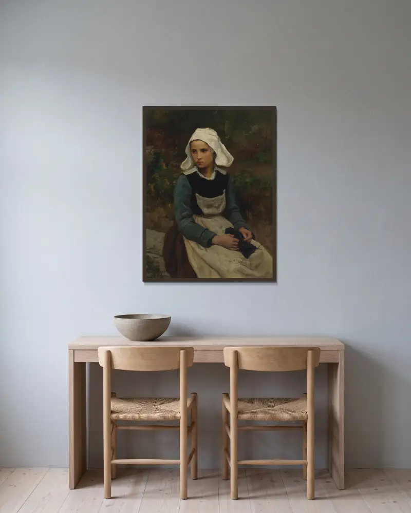 Ung bretonsk flicka som stickar av Jules Breton inramad på en vägg