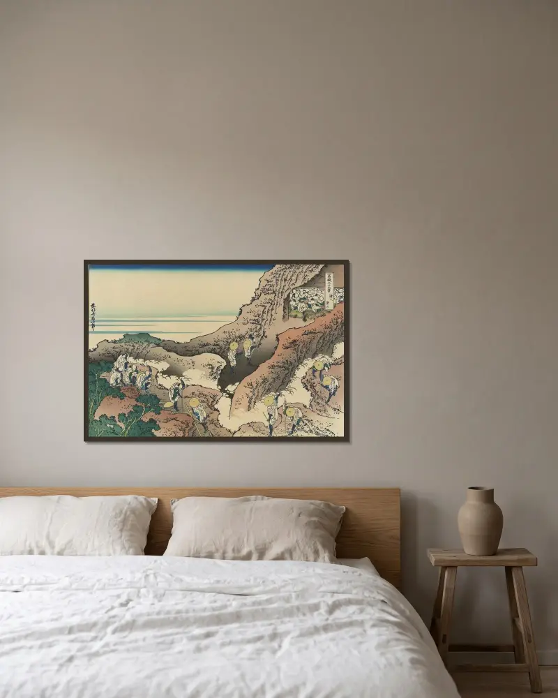 Folk som bestiger berget av Katsushika Hokusai inramad på en vägg
