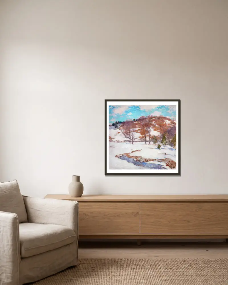 Snö i förbergen av Willard Leroy Metcalf inramad på en vägg