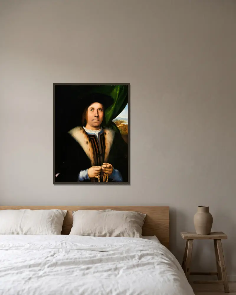 Porträtt av en man med radband av Lorenzo Lotto inramad på en vägg