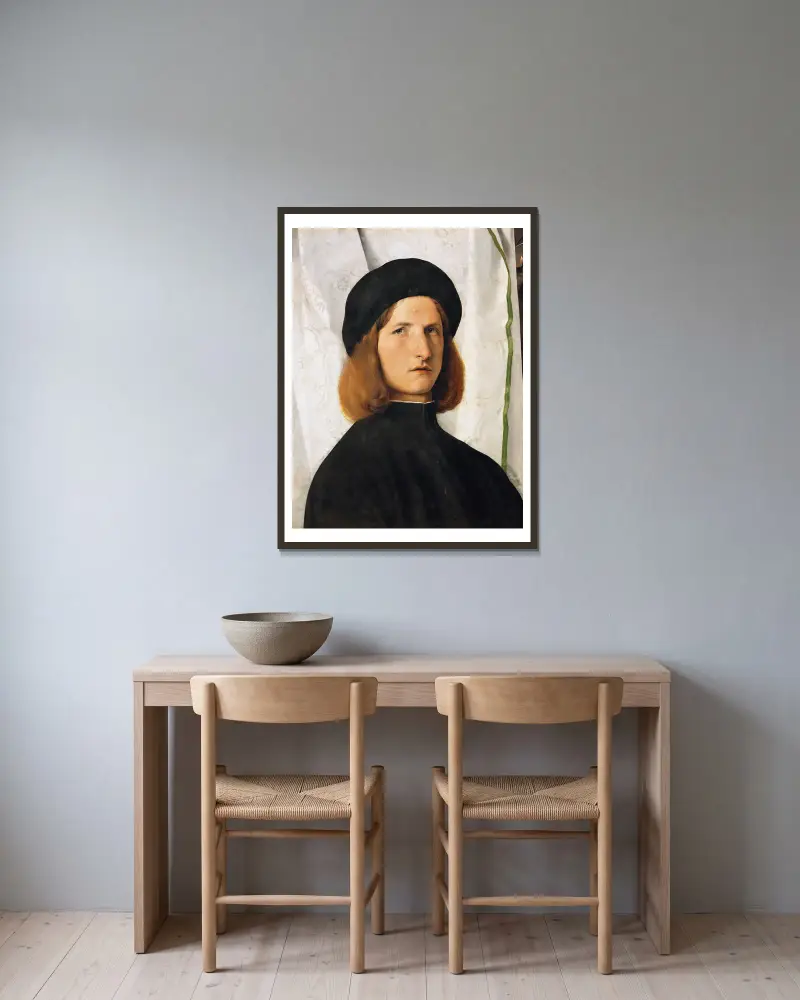 Porträtt av ung man med lampa av Lorenzo Lotto inramad på en vägg