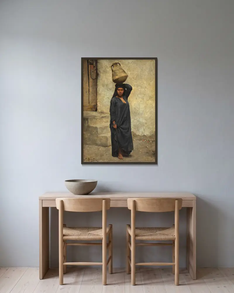 An Egyptian water carrier av Ludwig Deutsch inramad på en vägg