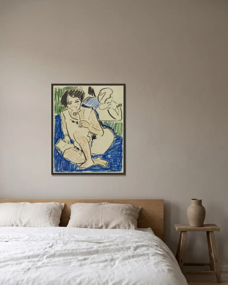 Hockende mit Buch von Ernst Ludwig Kirchner gerahmt an einer Wand