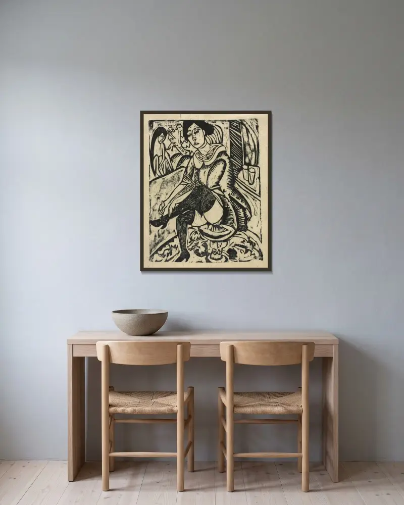 Kvinna som tar på sig sina skor av Ernst Ludwig Kirchner inramad på en vägg