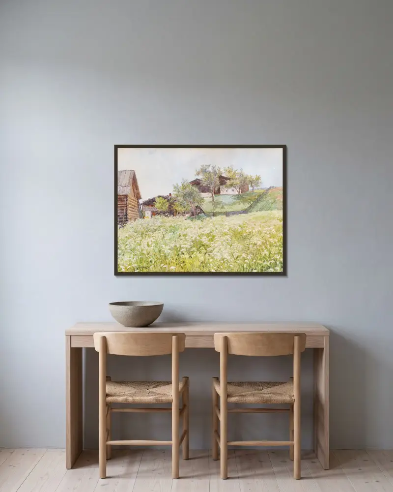 Bauernhäuser, ein weiß blühendes Feld davor von Marie Egner gerahmt an einer Wand