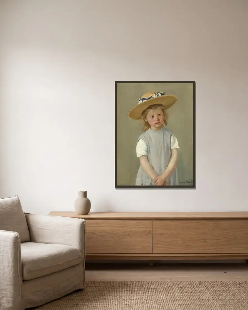Kind mit Strohhut von Mary Cassatt gerahmt an einer Wand