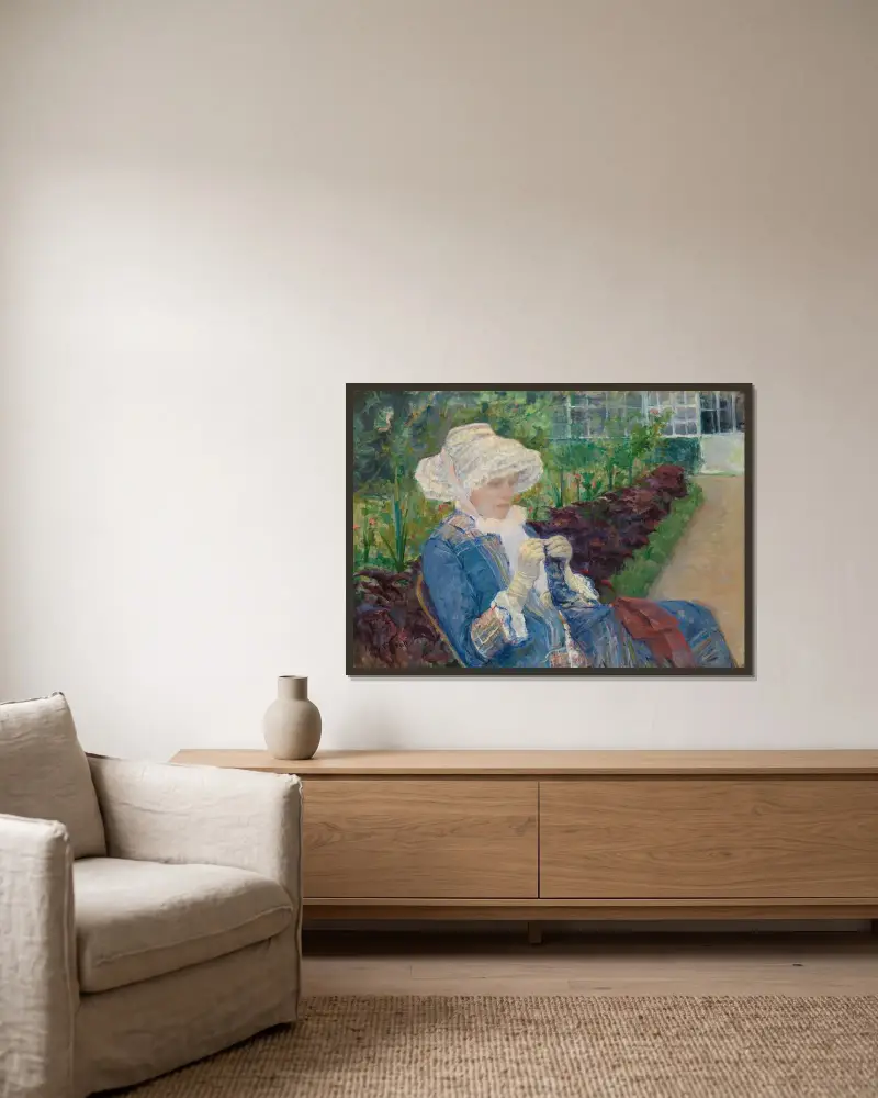 Lydia virkar i trädgården i Marly av Mary Cassatt inramad på en vägg