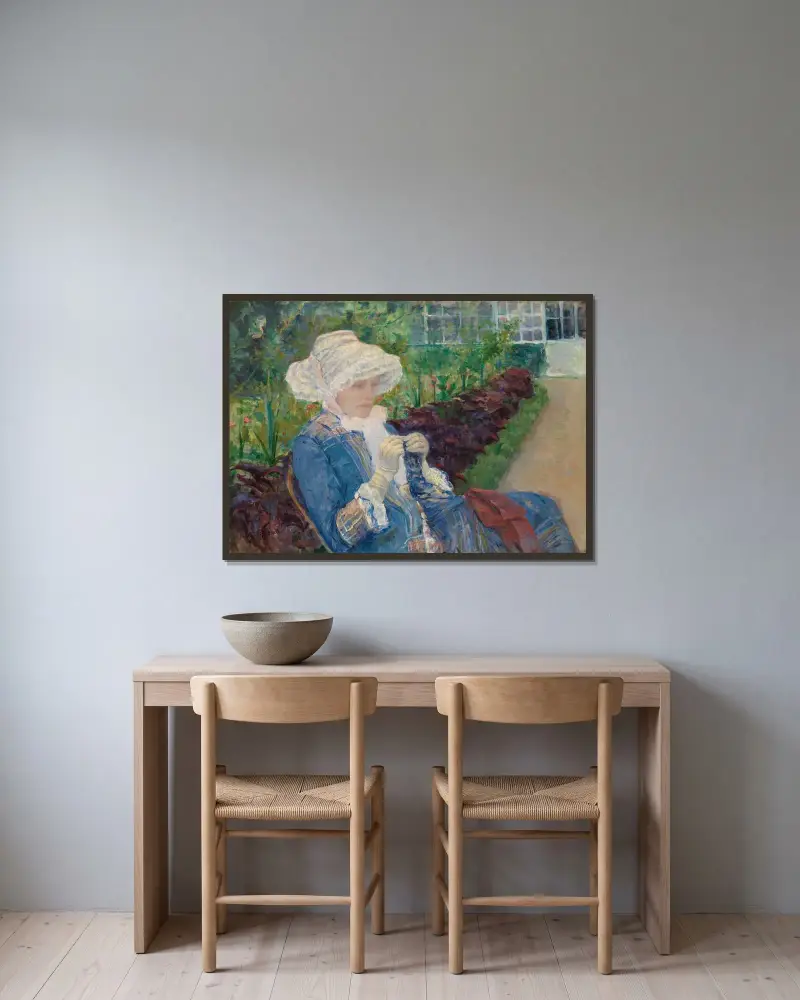 Lydia virkar i trädgården i Marly av Mary Cassatt inramad på en vägg