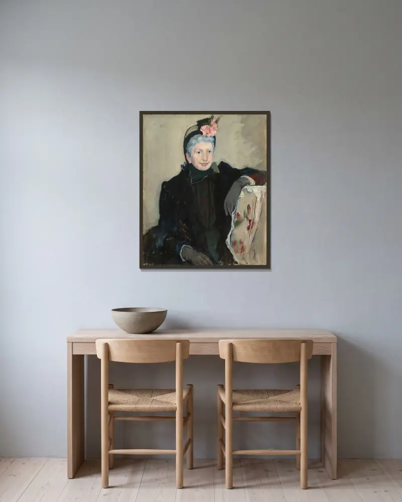 Porträtt av en äldre dam av Mary Cassatt inramad på en vägg